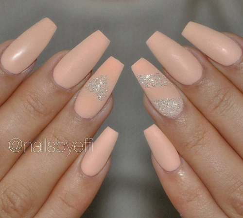peach-nail-polish-on-long-nails-with-glitter-heart