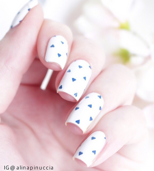 white-naildesign-with-blue-hearts