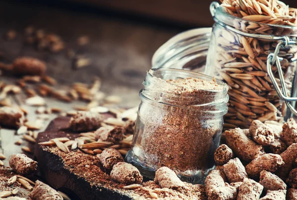 Oat bran, grain oats, oat flour, in glass jars — стоковое фото